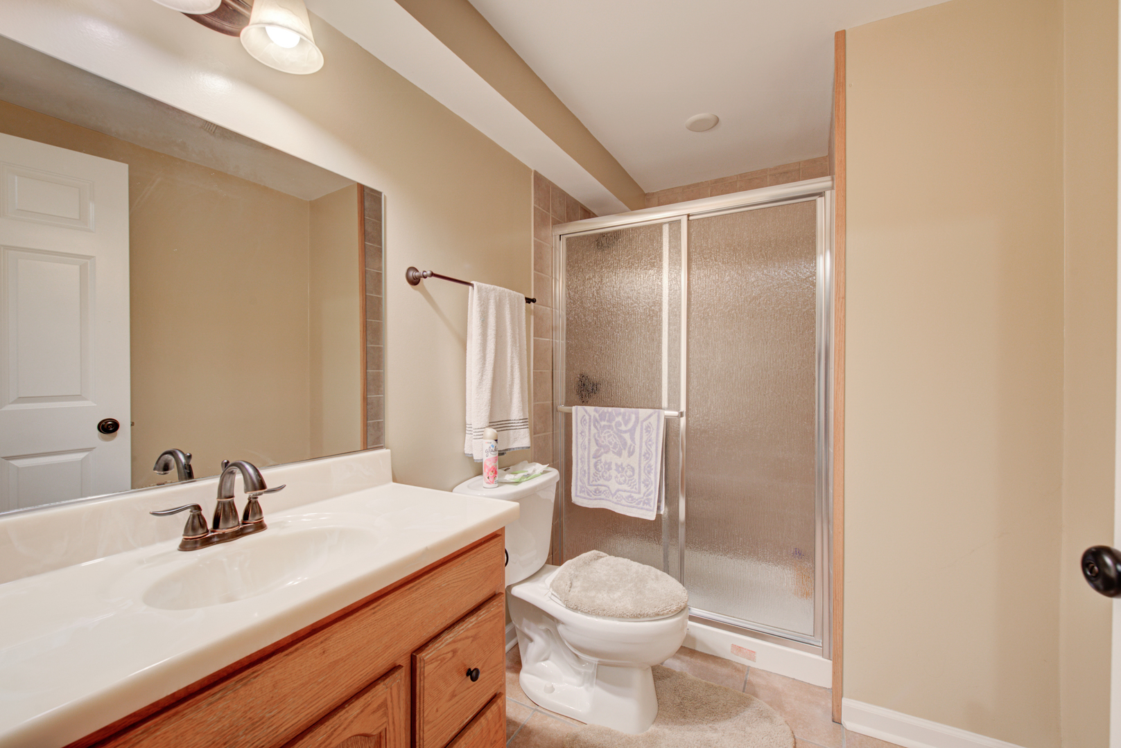 24520 Rockefeller Court Plainfield, IL 60544 - Photo 44 of 57 a bathroom with a sink toilet and shower