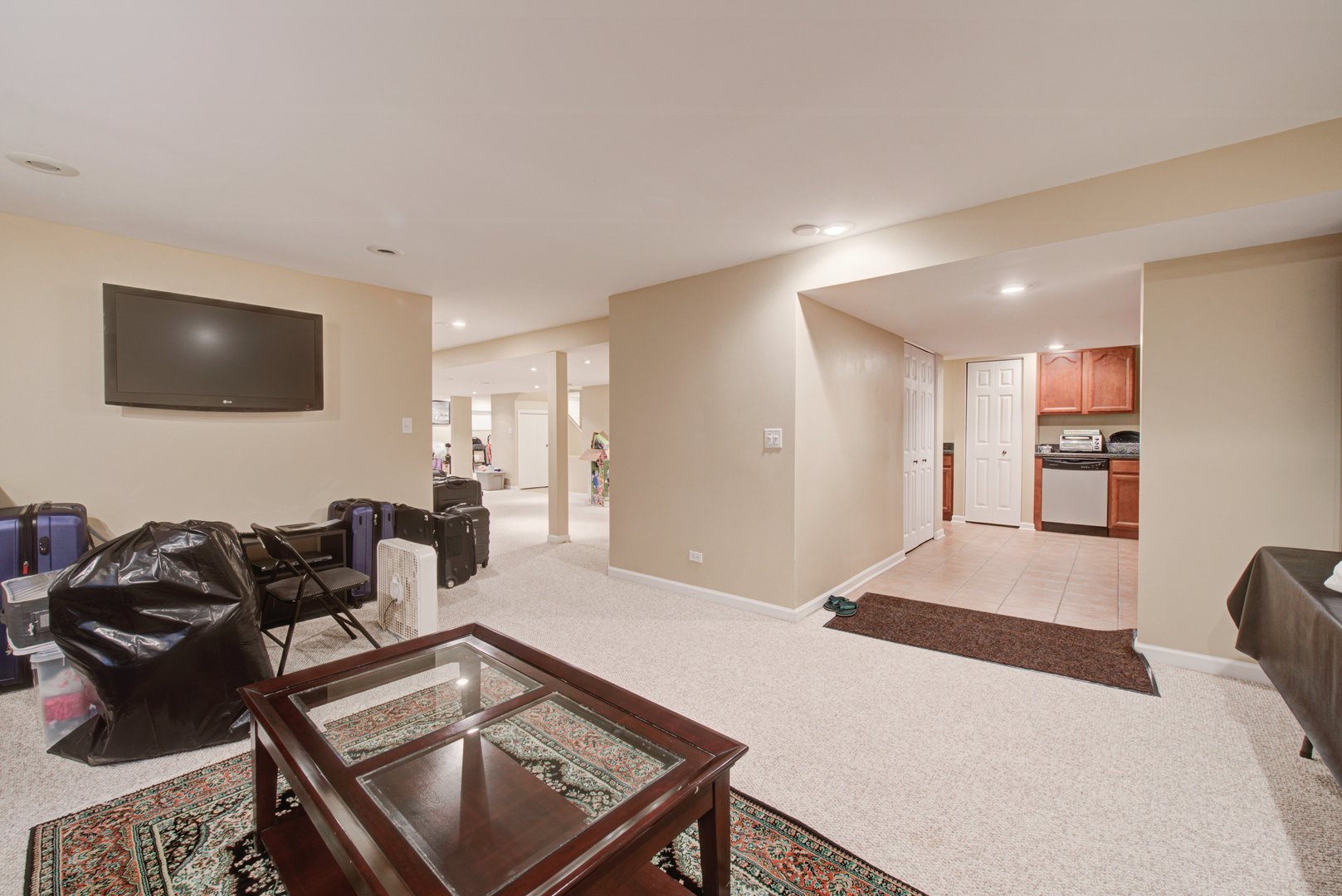 24520 Rockefeller Court Plainfield, IL 60544 - Photo 47 of 57 a living room with furniture and a flat screen tv
