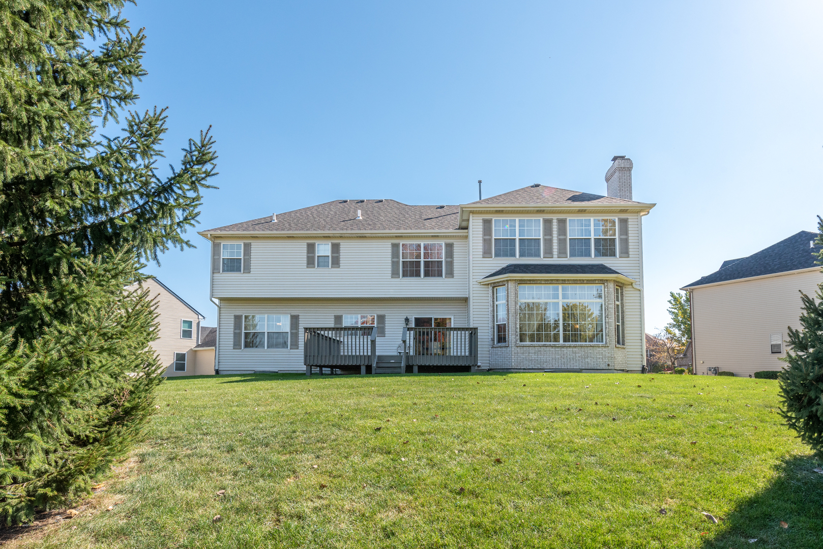 24520 Rockefeller Court Plainfield, IL 60544 - Photo 50 of 57 a front view of a house with a garden