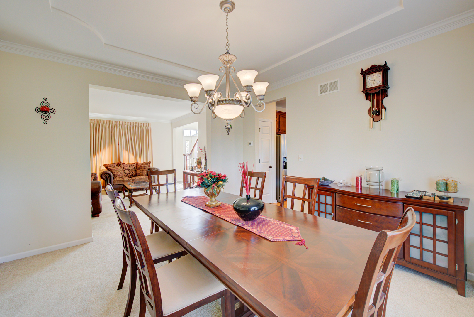 24520 Rockefeller Court Plainfield, IL 60544 - Photo 9 of 57 a view of a dining room with furniture and chandelier