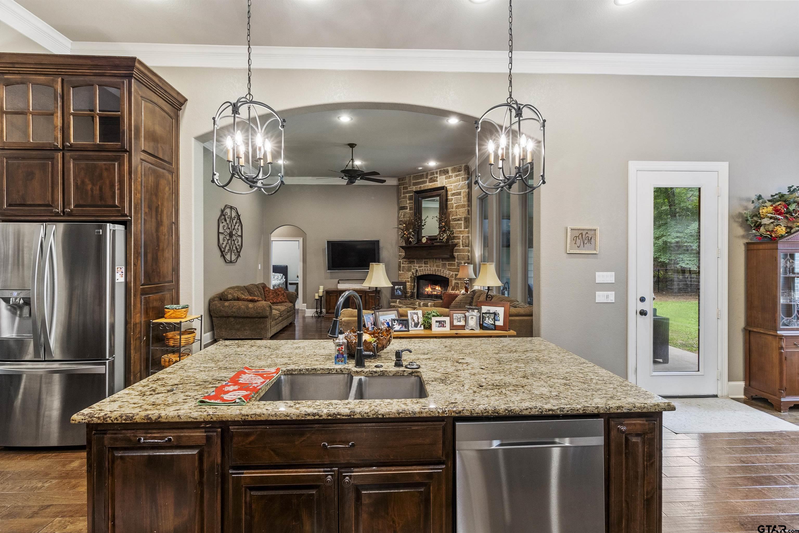 21755 Pagosa Ranch Road Bullard, TX 75757 - Photo 18 of 37 a kitchen with stainless steel appliances granite countertop a stove and refrigerator