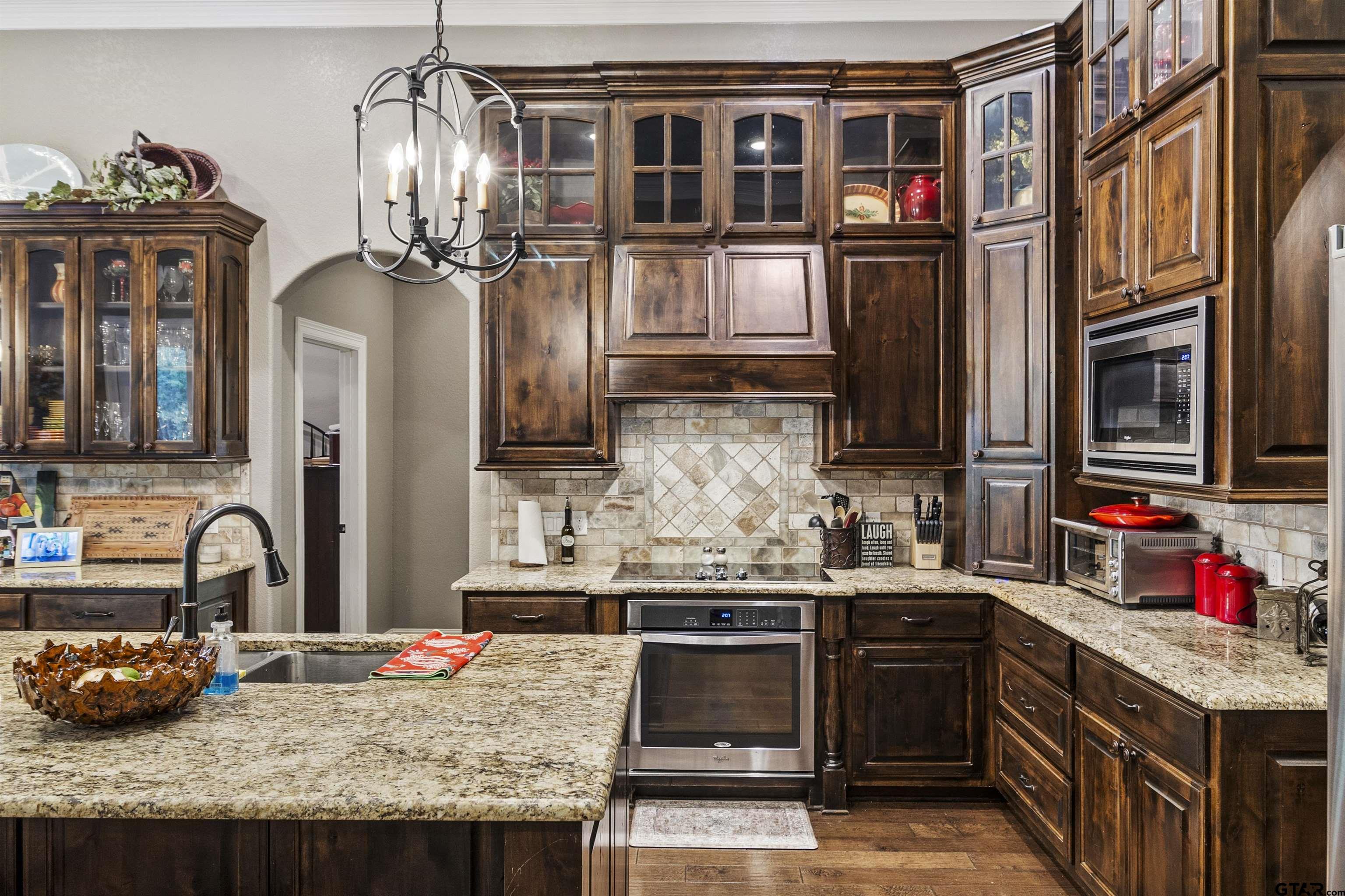 21755 Pagosa Ranch Road Bullard, TX 75757 - Photo 20 of 37 a kitchen with stainless steel appliances granite countertop a sink stove and refrigerator