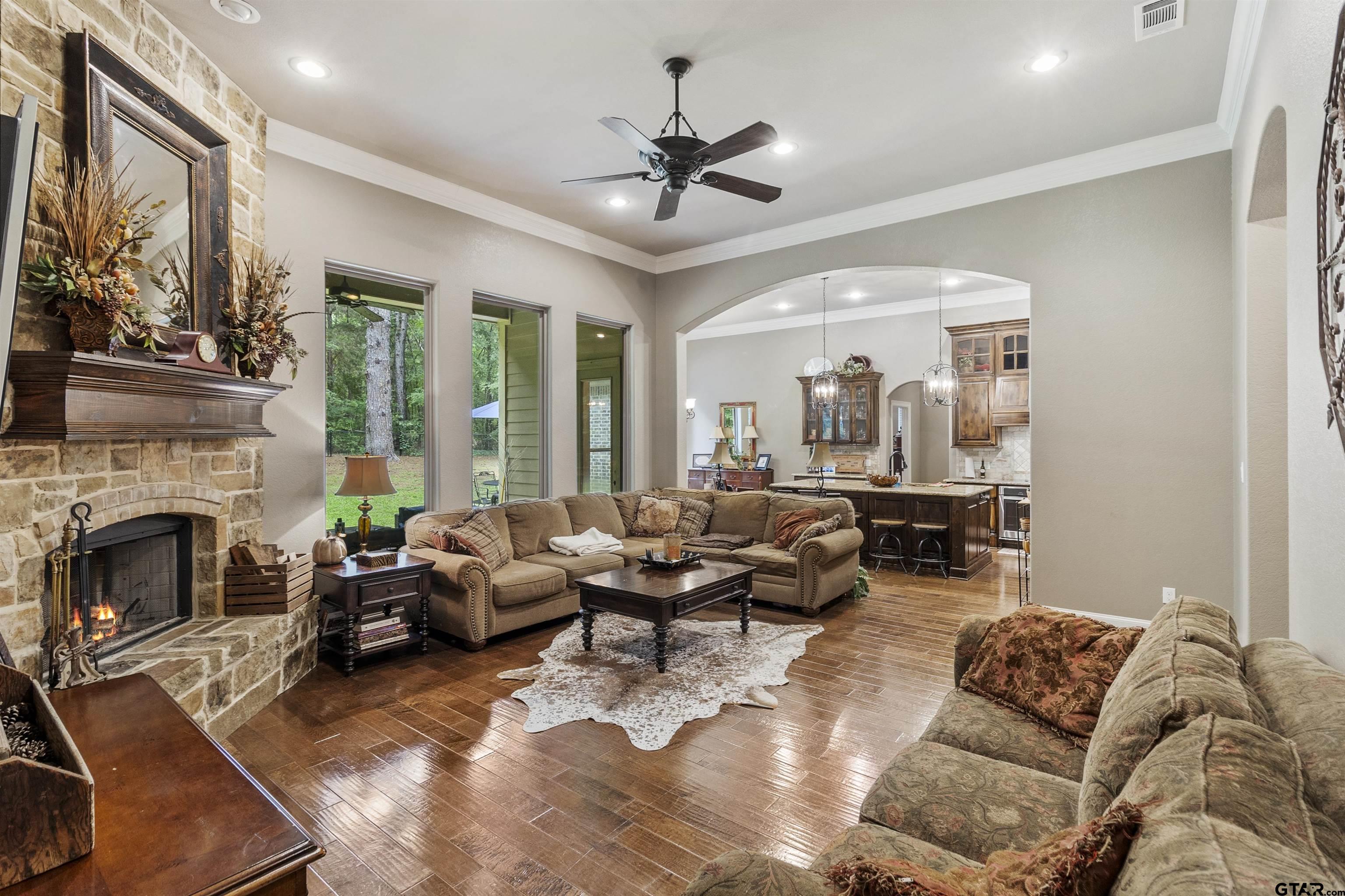 21755 Pagosa Ranch Road Bullard, TX 75757 - Photo 21 of 37 a living room with furniture fireplace and a large window