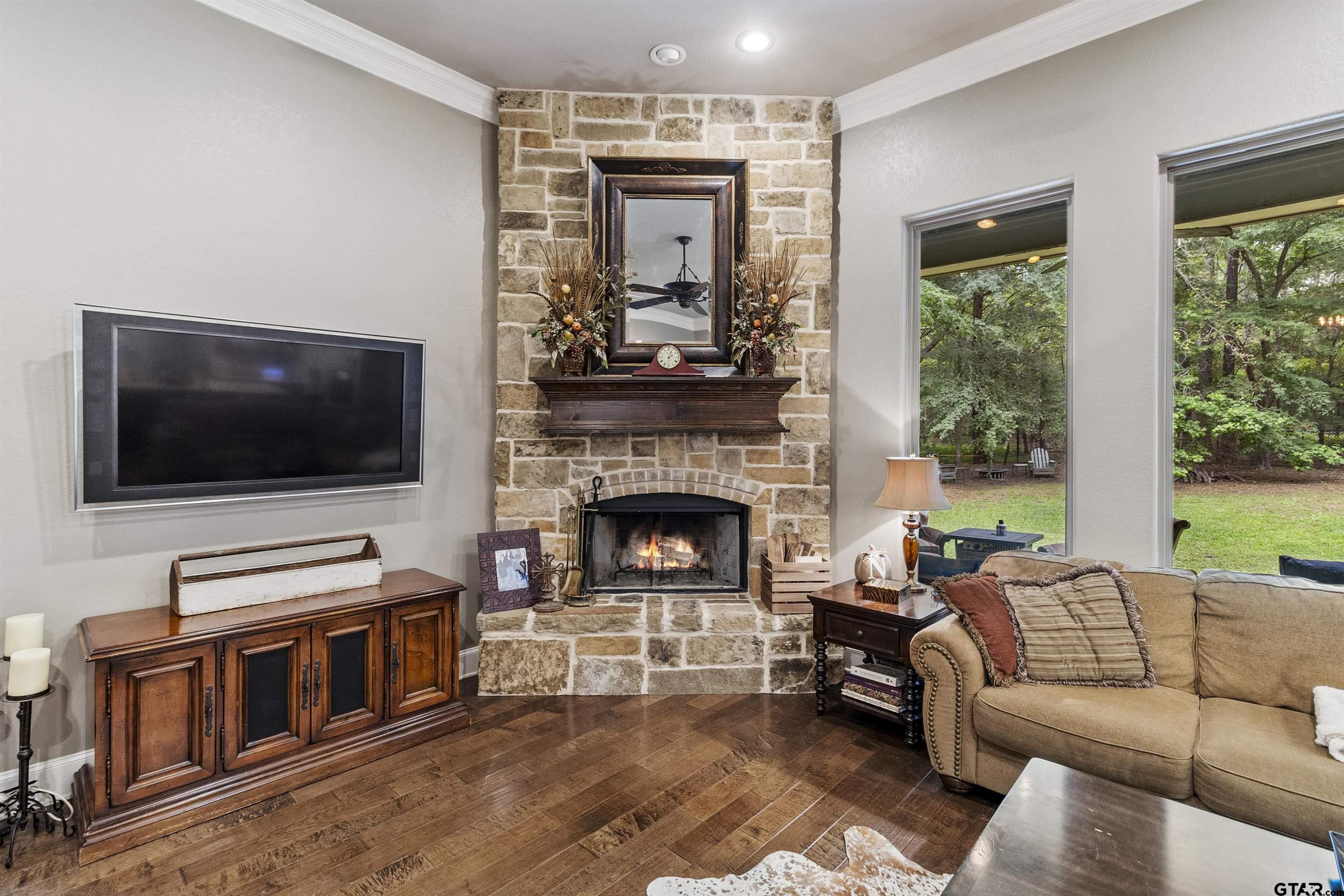21755 Pagosa Ranch Road Bullard, TX 75757 - Photo 28 of 37 a living room with furniture and a flat screen tv