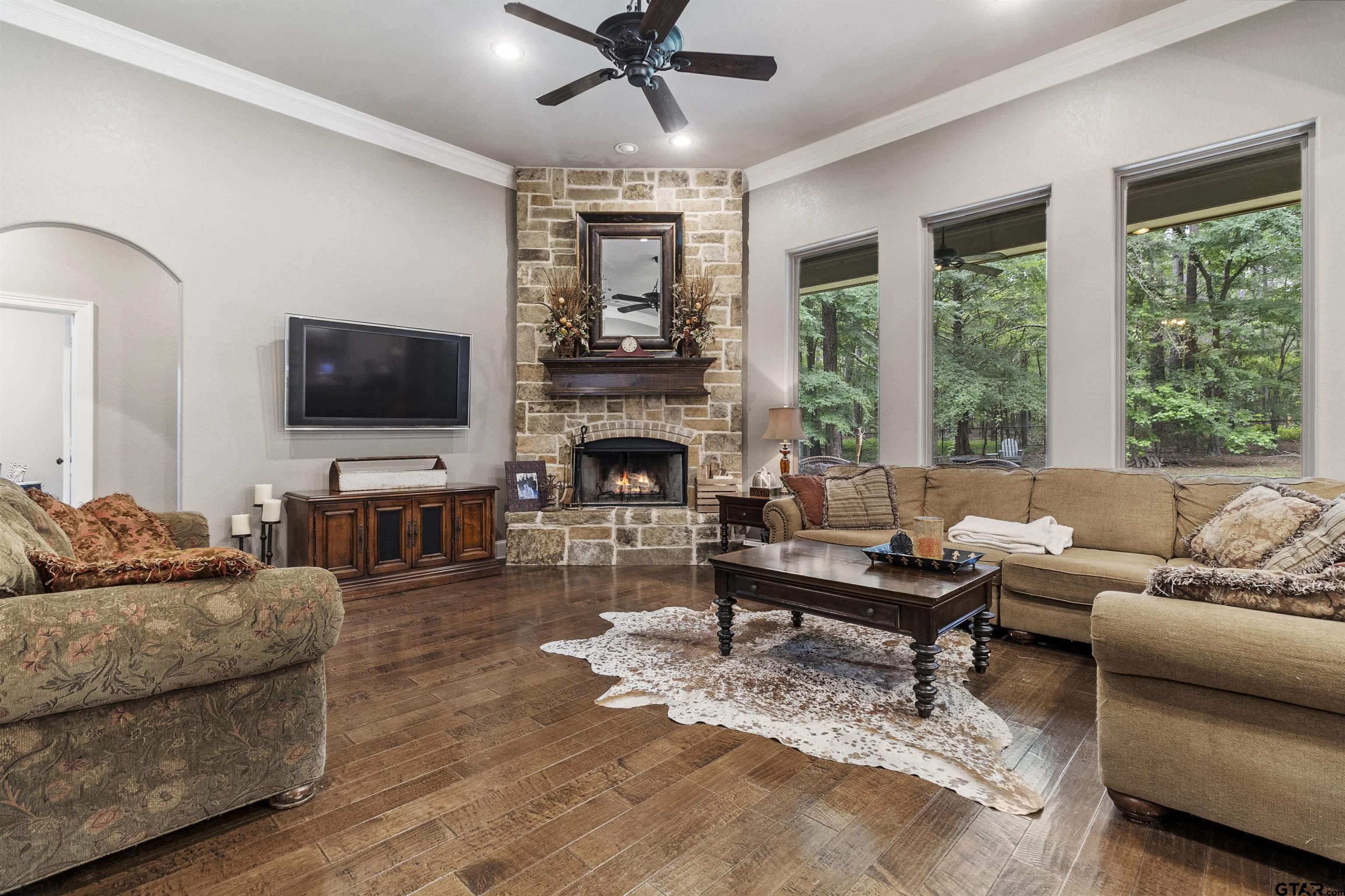 21755 Pagosa Ranch Road Bullard, TX 75757 - Photo 29 of 37 a living room with furniture flat screen tv and a large window