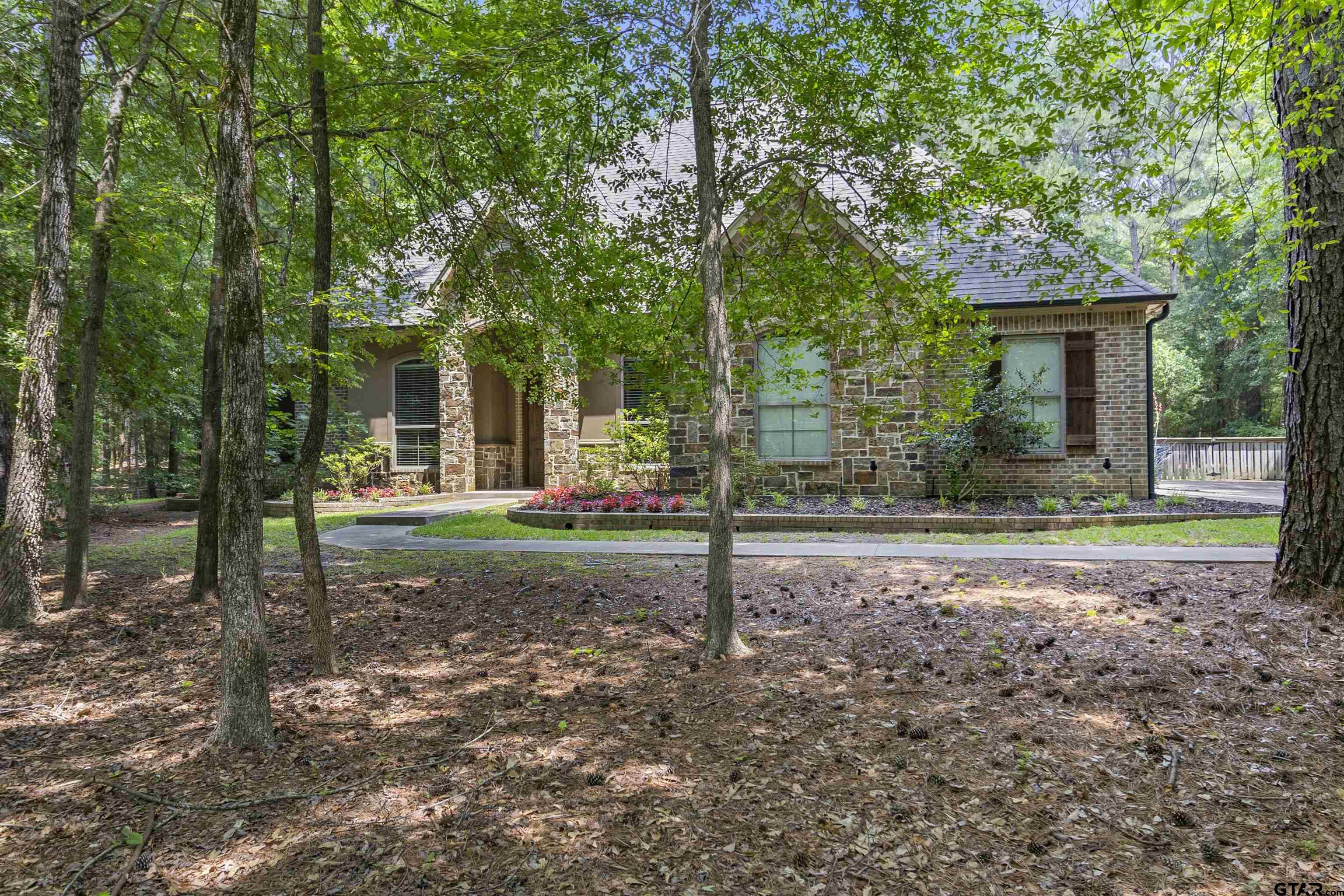 21755 Pagosa Ranch Road Bullard, TX 75757 - Photo 3 of 37 a view of a house with backyard and trees