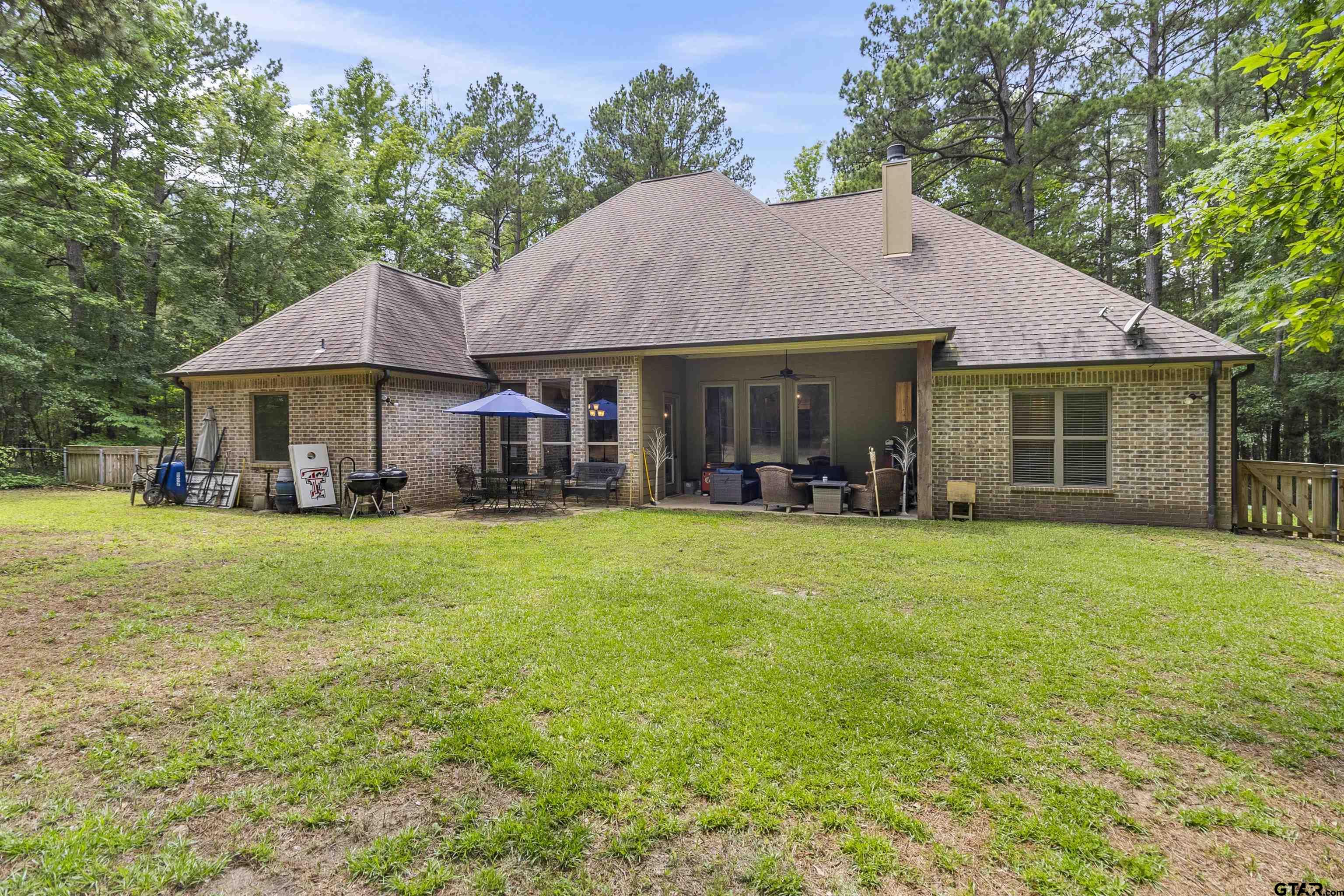 21755 Pagosa Ranch Road Bullard, TX 75757 - Photo 10 of 37 a backyard of a house with lots of green space