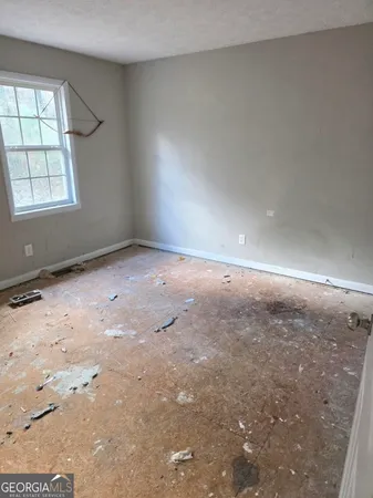 an empty room with windows