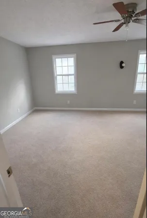 an empty room with windows