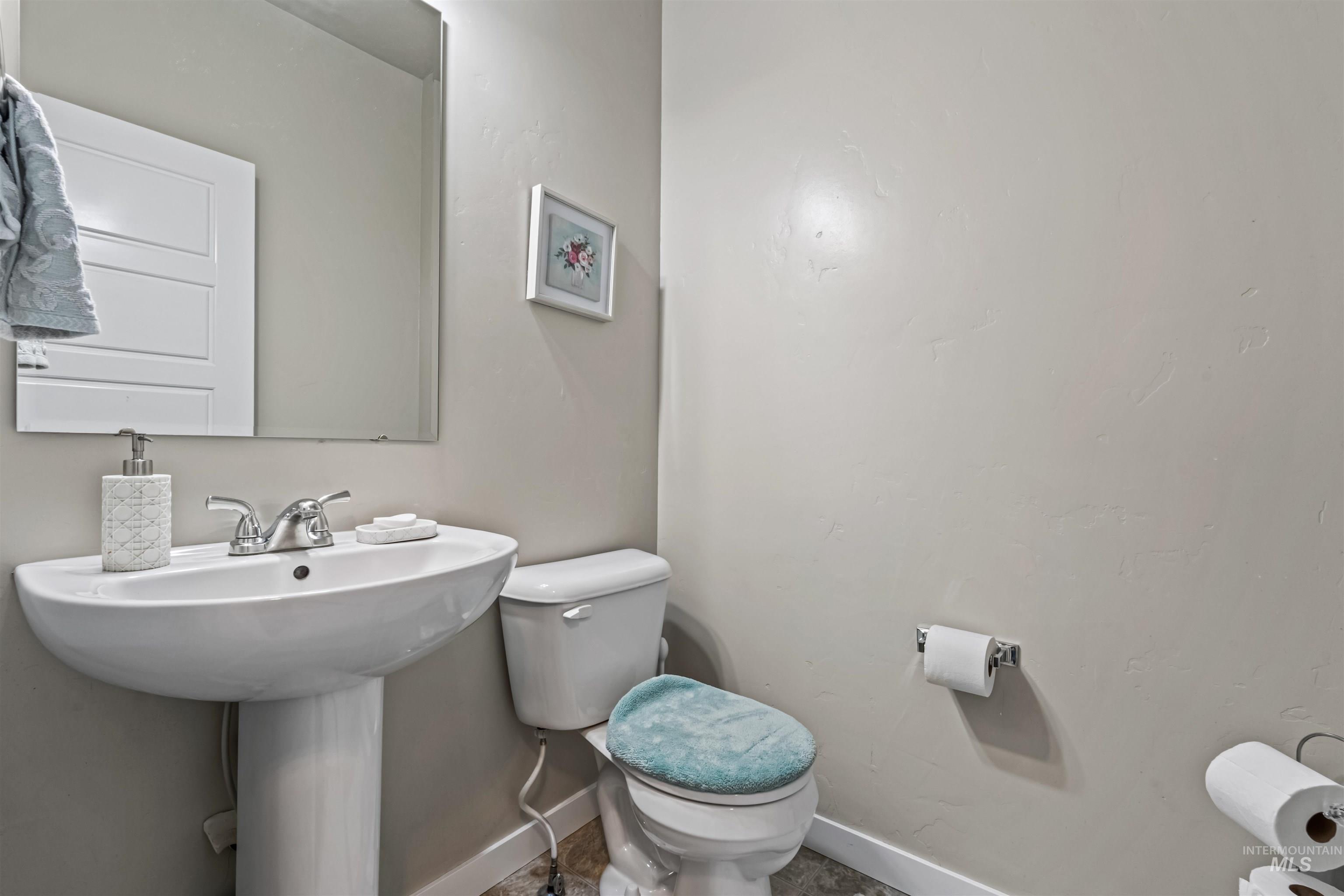 12030 West Abram Street Boise, ID 83713 - Photo 12 of 26 Bathroom with toilet and baseboards