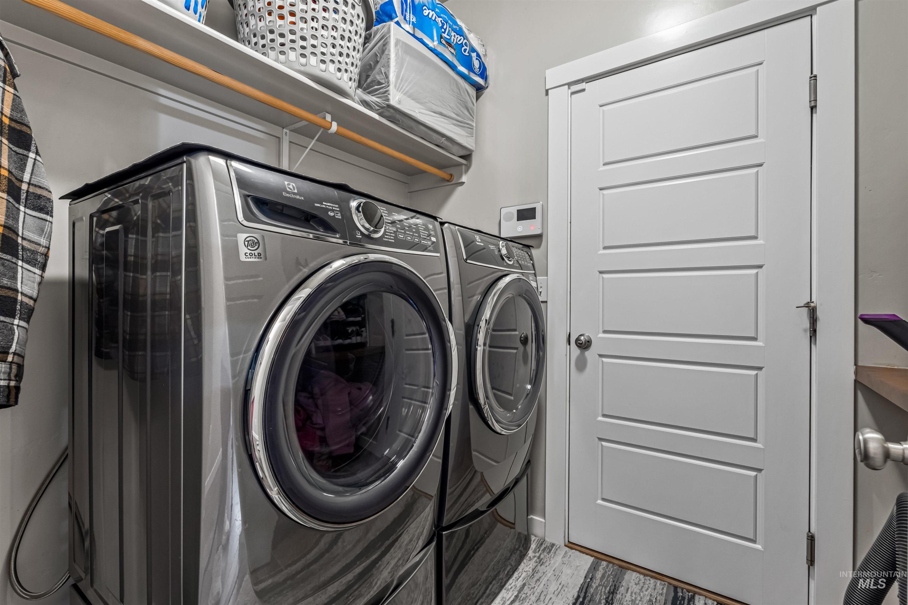 12030 West Abram Street Boise, ID 83713 - Photo 13 of 26 Laundry area featuring independent washer and dryer and wood finished floors
