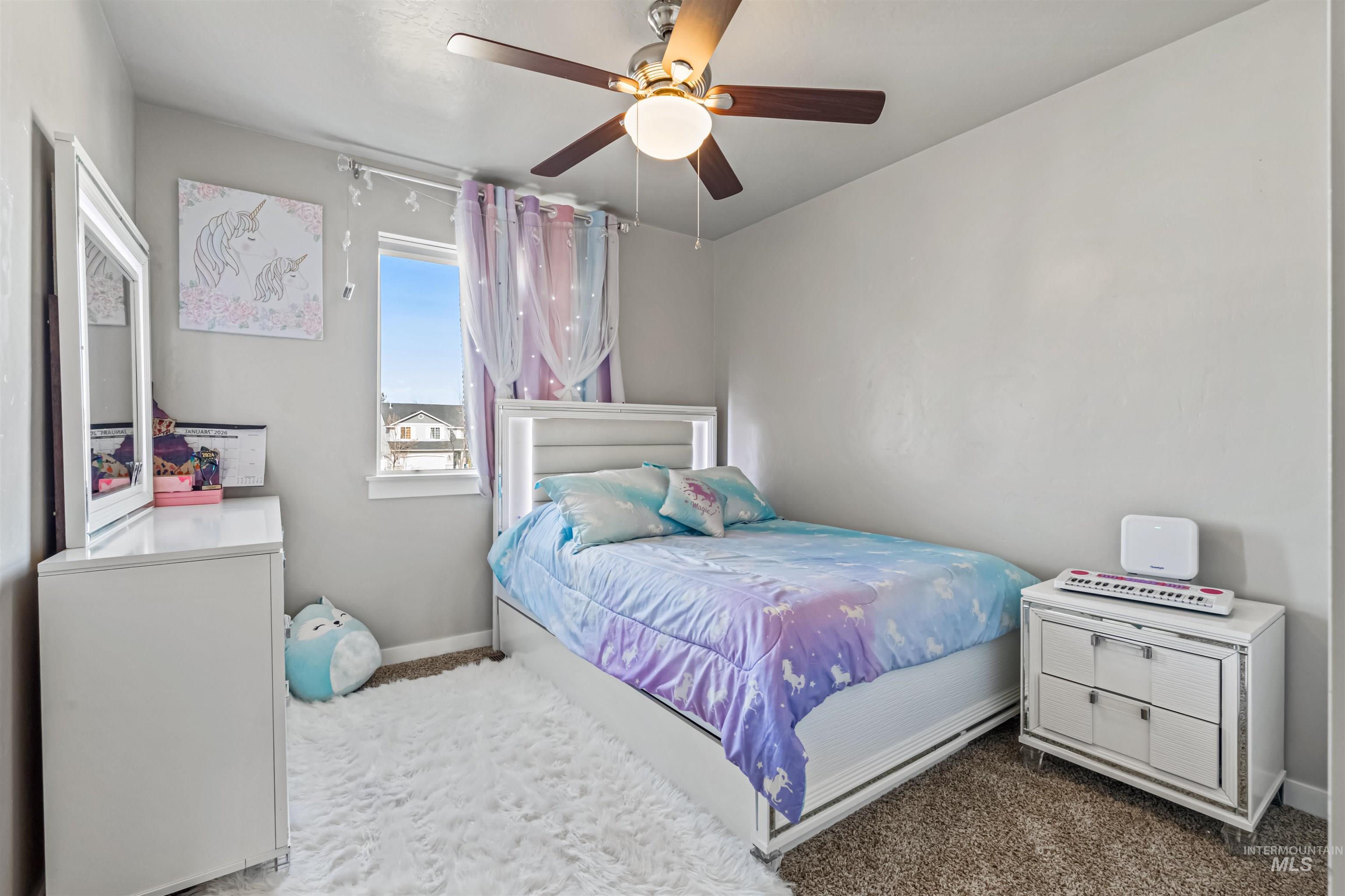 12030 West Abram Street Boise, ID 83713 - Photo 20 of 26 Bedroom with carpet flooring and a ceiling fan