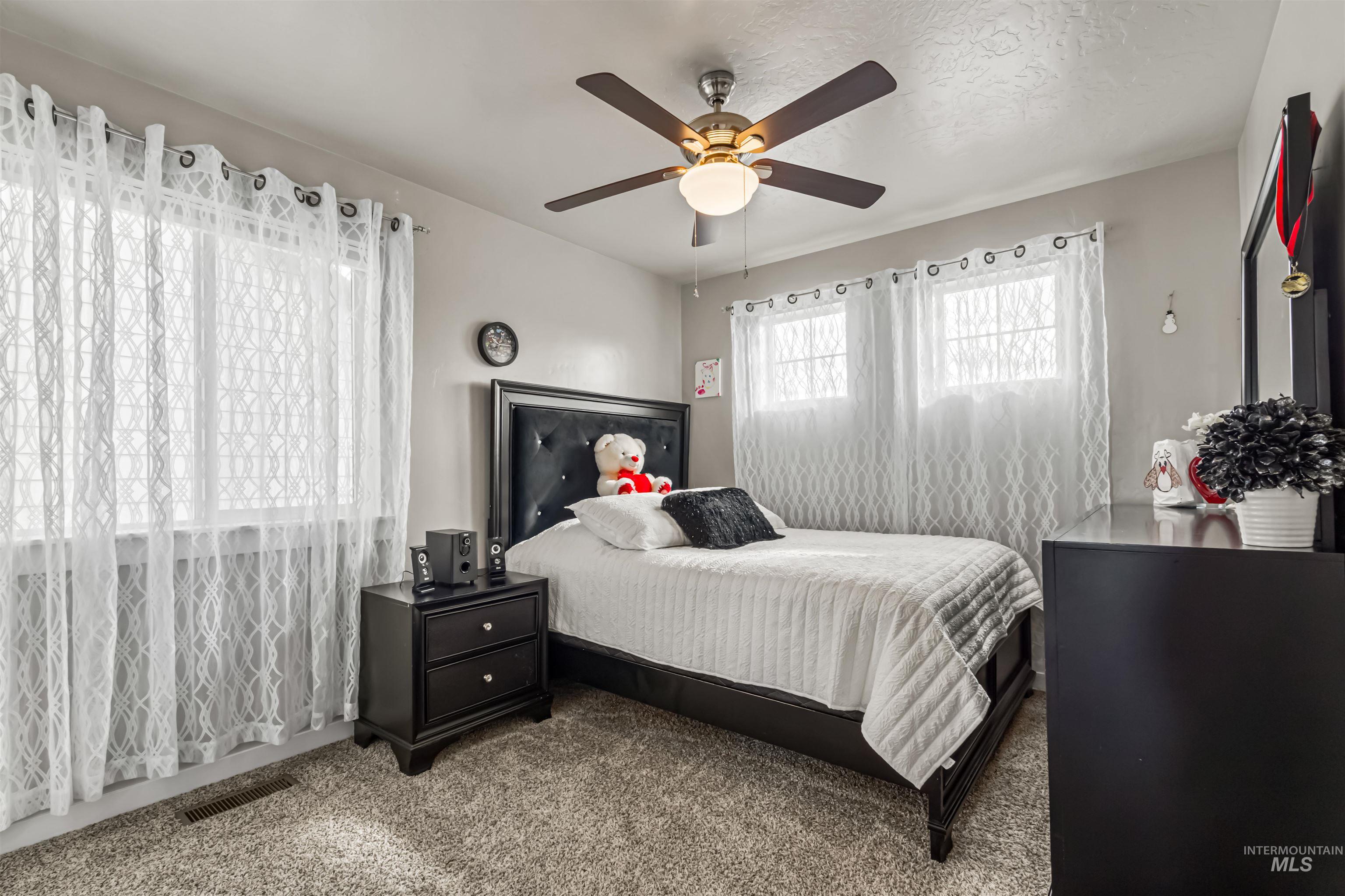 12030 West Abram Street Boise, ID 83713 - Photo 21 of 26 Bedroom with carpet and a ceiling fan