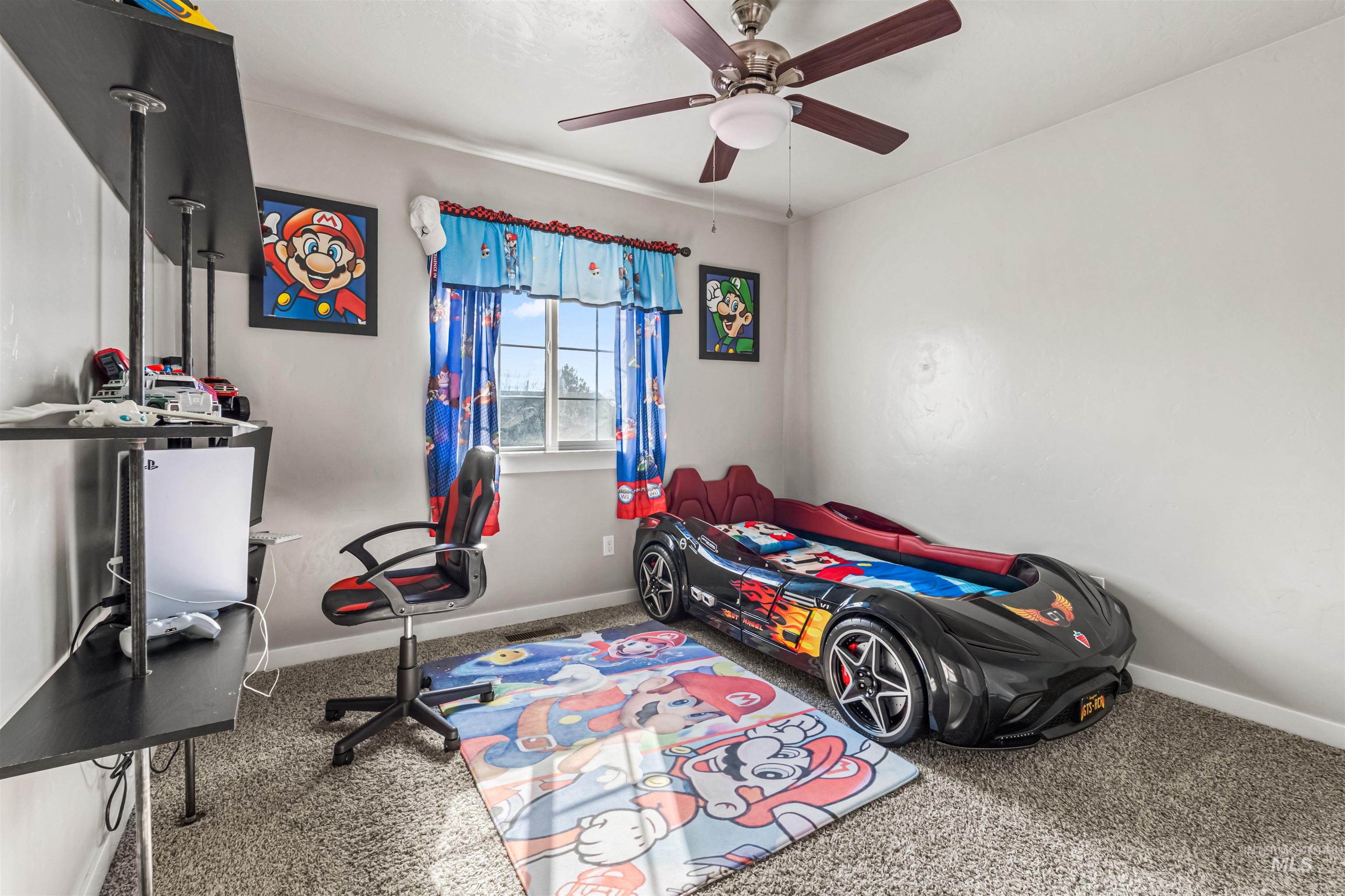 12030 West Abram Street Boise, ID 83713 - Photo 22 of 26 Carpeted bedroom featuring baseboards and ceiling fan