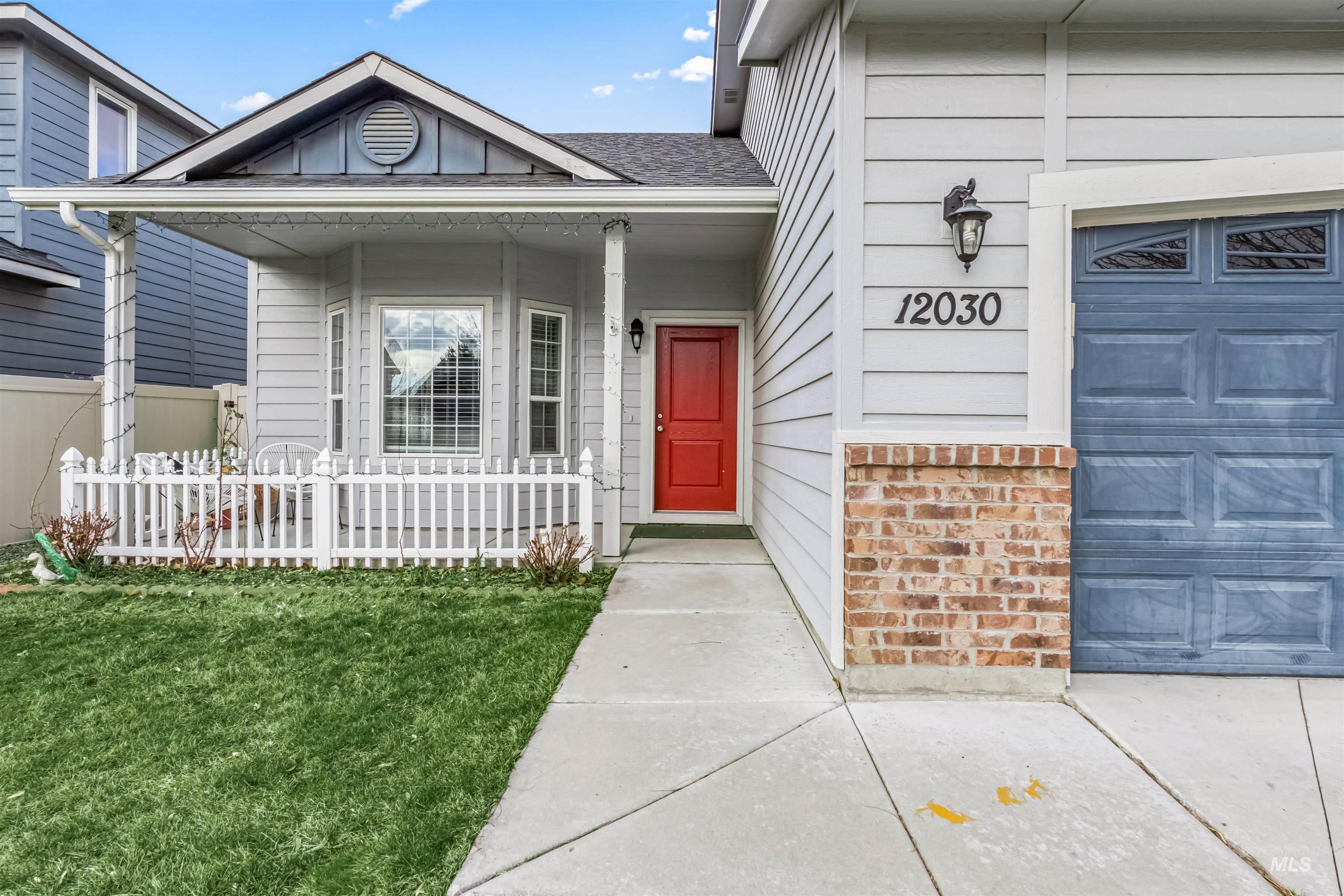 12030 West Abram Street Boise, ID 83713 - Photo 3 of 26 View of exterior entry with covered porch and roof with shingles