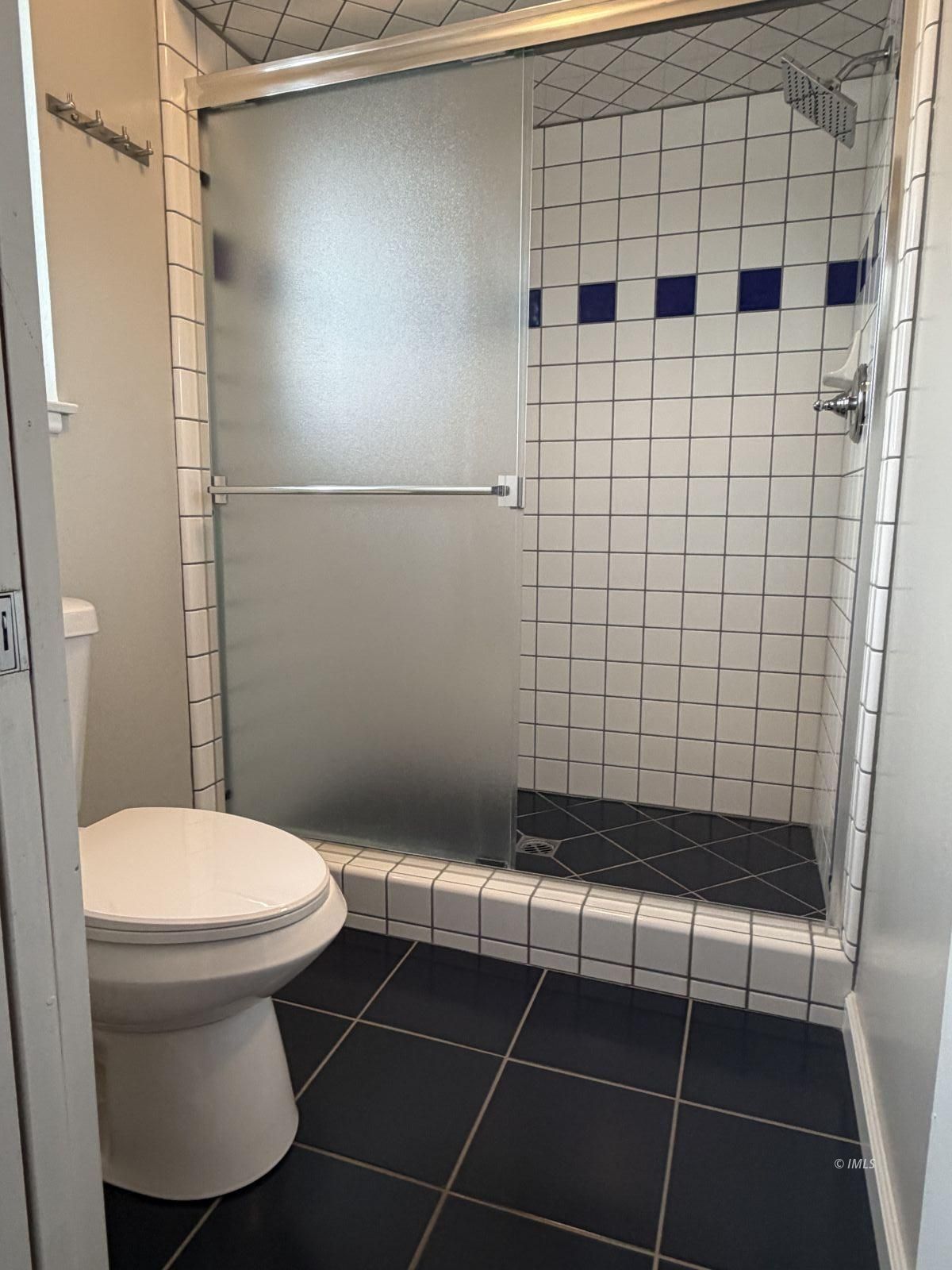 320 Apollo Circle Bishop, CA 93514 - Photo 12 of 35 a bathroom with a toilet and a shower