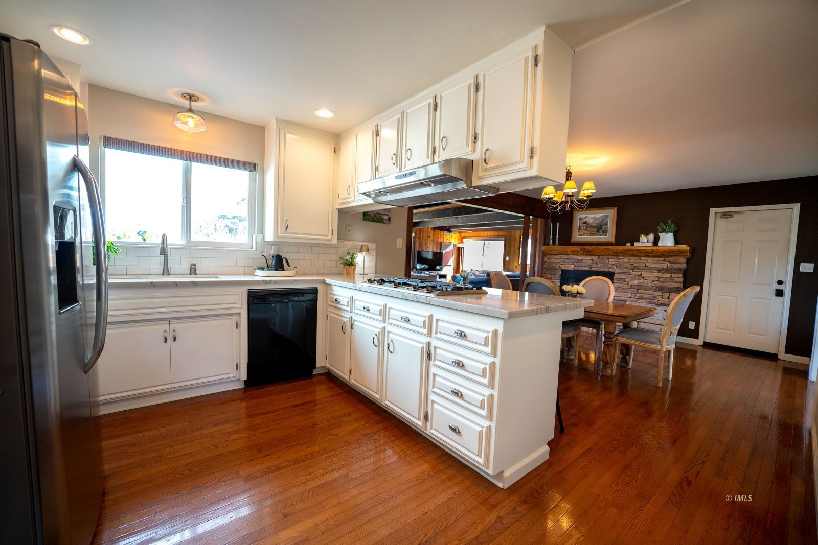 320 Apollo Circle Bishop, CA 93514 - Photo 15 of 35 a kitchen with a sink cabinets and wooden floor