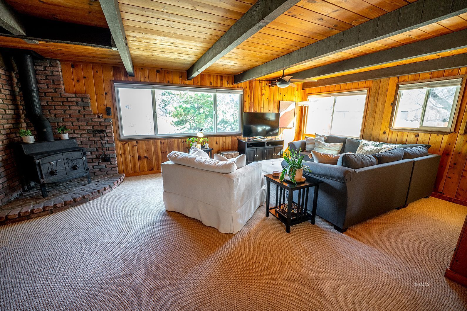 320 Apollo Circle Bishop, CA 93514 - Photo 21 of 35 a living room with fireplace furniture and a large window