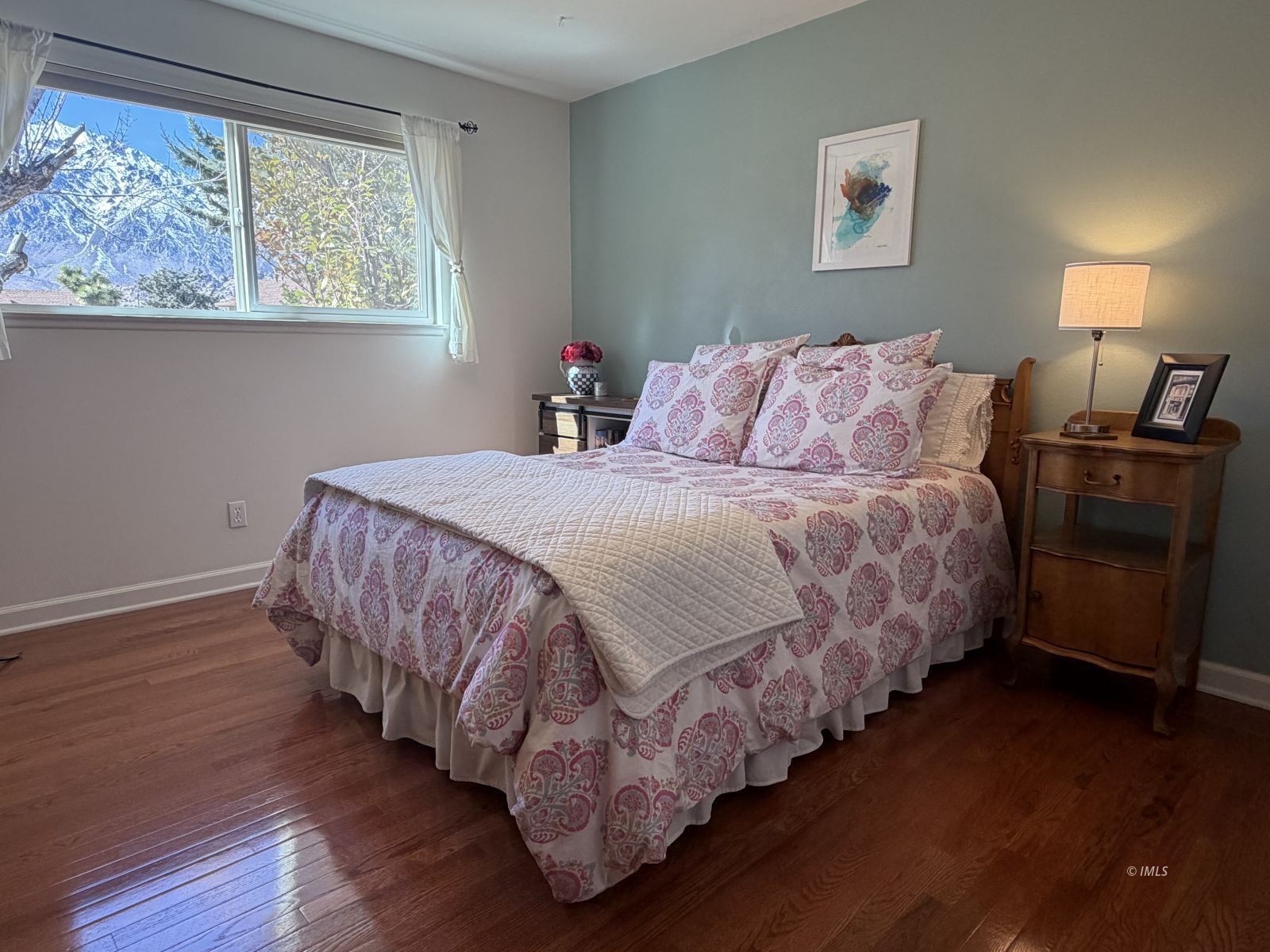 320 Apollo Circle Bishop, CA 93514 - Photo 8 of 35 a bedroom with a bed and wooden floor