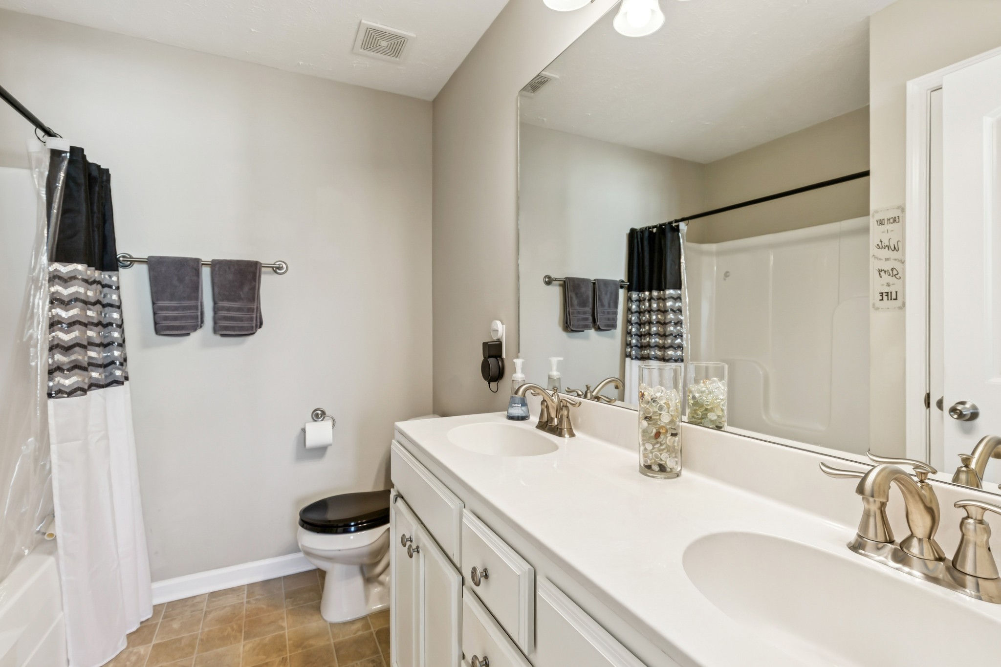 5840 Monroe Crossing Antioch, TN 37013 - Photo 17 of 25 a bathroom with a sink toilet double vanity and shower