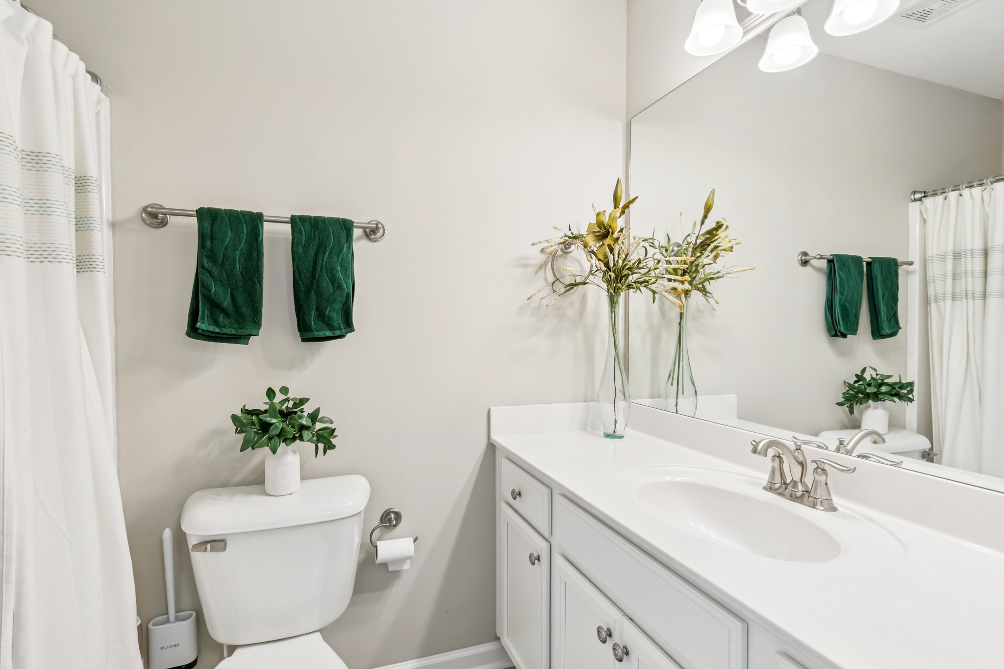 5840 Monroe Crossing Antioch, TN 37013 - Photo 22 of 25 a bathroom with a toilet sink and mirror