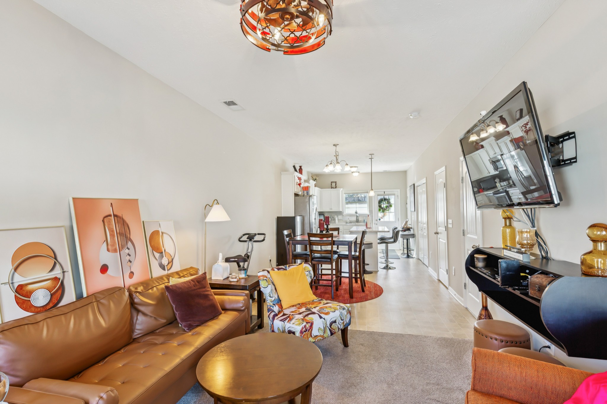 5840 Monroe Crossing Antioch, TN 37013 - Photo 5 of 25 a living room with furniture and a chandelier