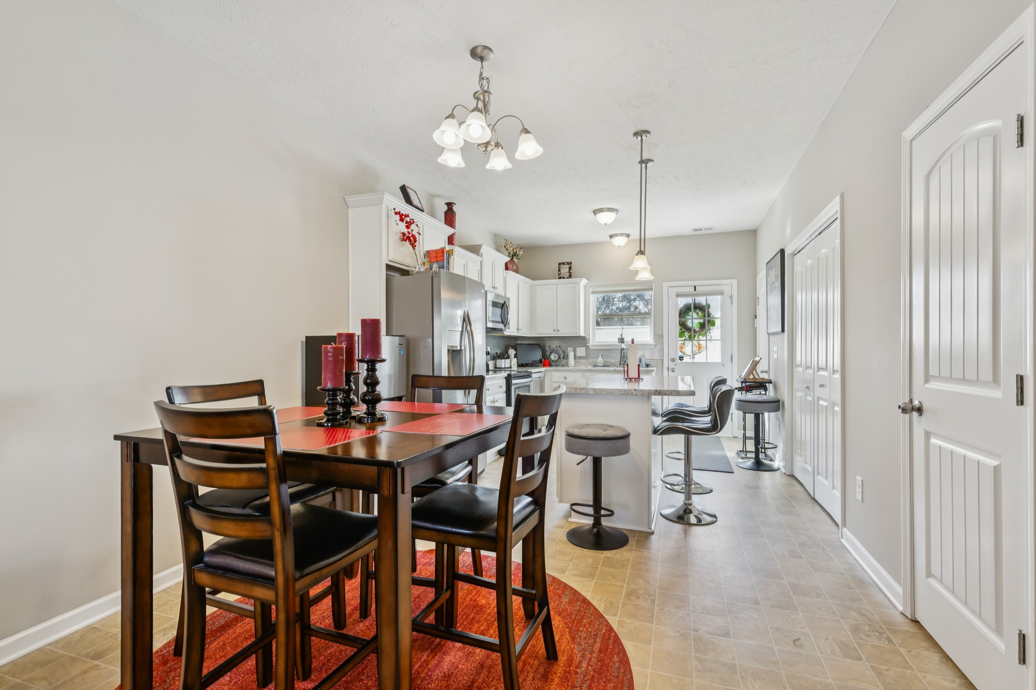 5840 Monroe Crossing Antioch, TN 37013 - Photo 8 of 25 a view of a dining room with furniture and chandelier
