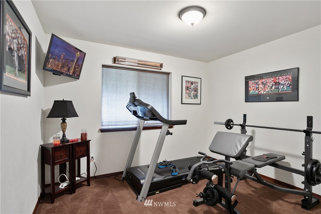 5129 180th Trail Southwest Rochester, WA 98579 - Photo 11 of 22 a view of a workspace with furniture and a window