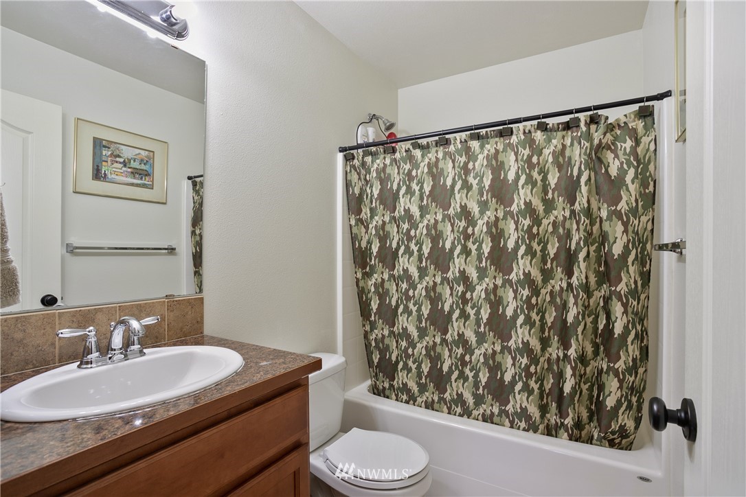 5129 180th Trail Southwest Rochester, WA 98579 - Photo 12 of 22 a bathroom with a sink toilet and shower