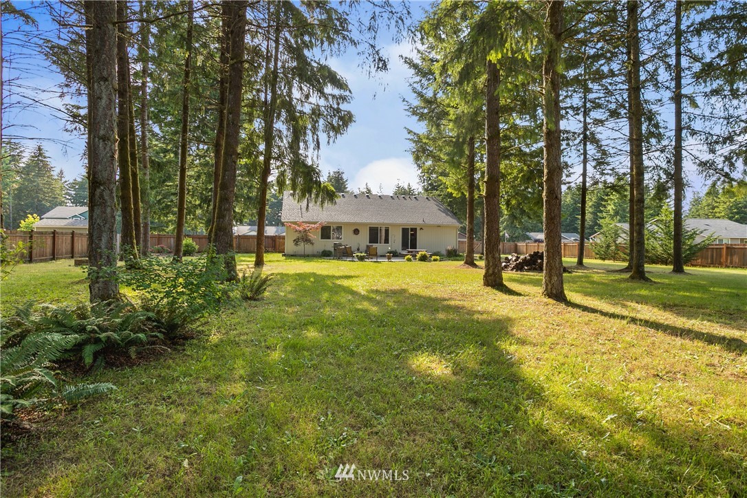 5129 180th Trail Southwest Rochester, WA 98579 - Photo 20 of 22 a view of a house with swimming pool and sitting area