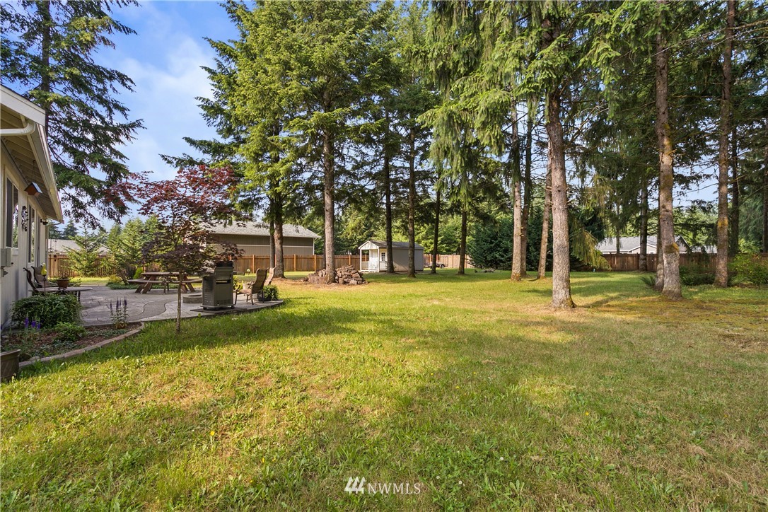5129 180th Trail Southwest Rochester, WA 98579 - Photo 21 of 22 a view of yard with trees