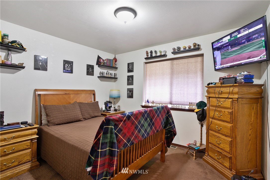 5129 180th Trail Southwest Rochester, WA 98579 - Photo 10 of 22 a bedroom with bed and a window