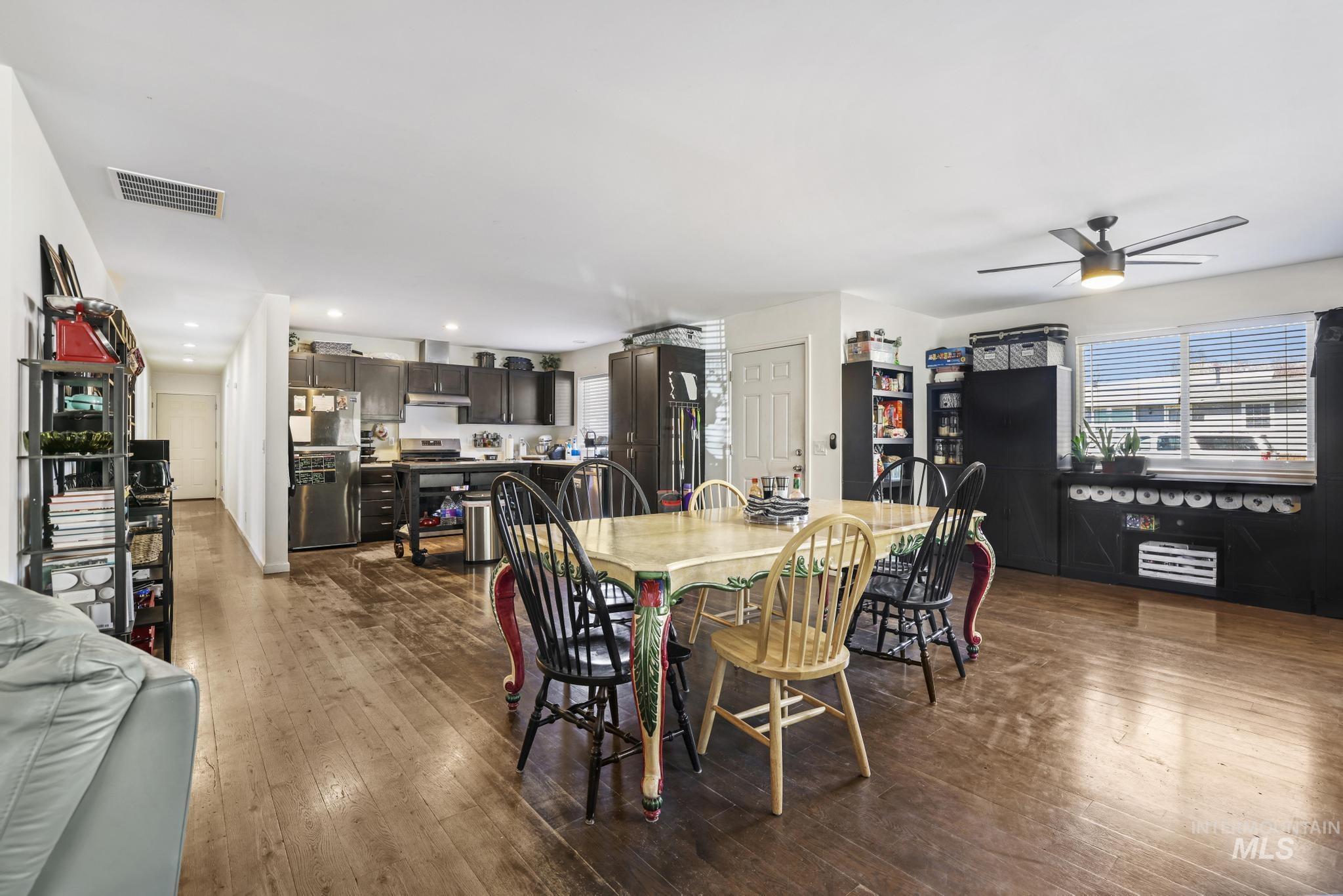 321 North 7th Street Bellevue, ID 83313 - Photo 3 of 15 Dining room featuring dark wood-style floors, ceiling fan, recessed lighting, and healthy amount of natural light