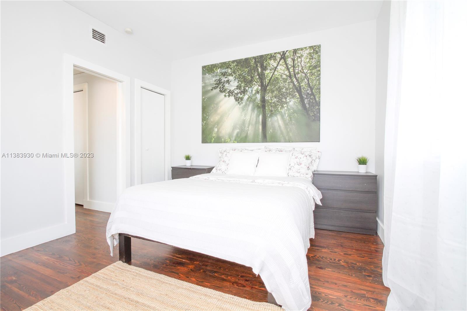 830 10th Street, Unit 3 Miami Beach, FL 33139 - Photo 17 of 22 a bedroom with a bed and a window