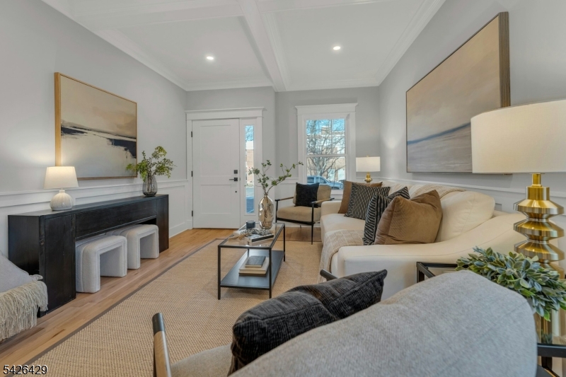 21 Spruce Street Cranford, NJ 07016 - Photo 12 of 40 a living room with furniture and a lamp