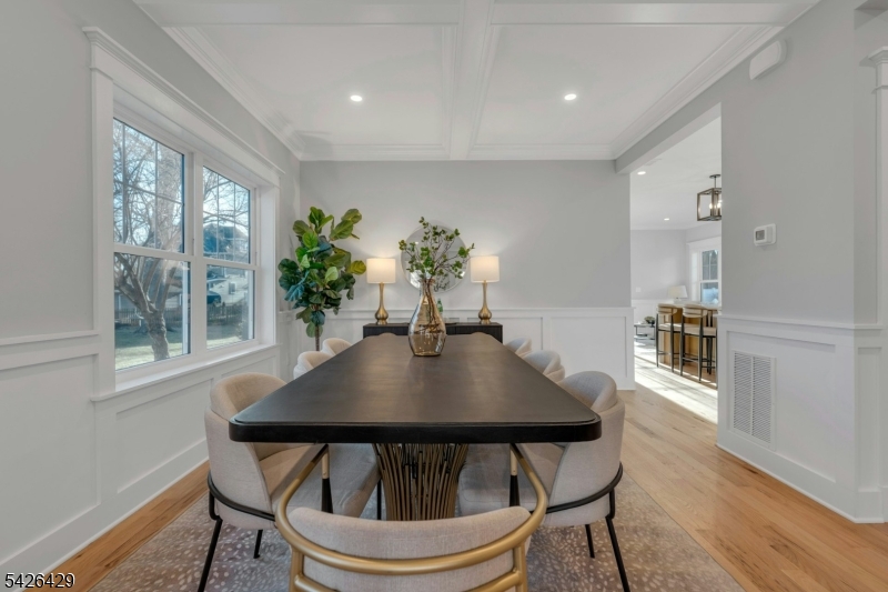 21 Spruce Street Cranford, NJ 07016 - Photo 13 of 40 a view of a dining room with furniture and wooden floor