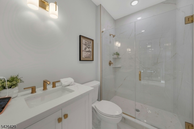 21 Spruce Street Cranford, NJ 07016 - Photo 17 of 40 a bathroom with a sink toilet and shower
