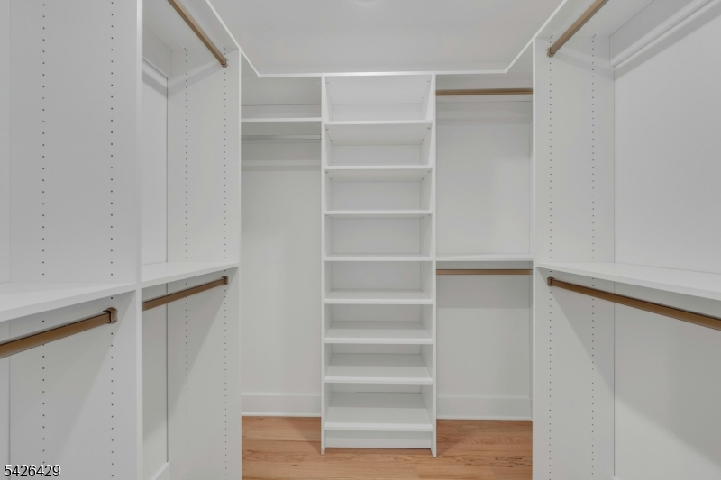 21 Spruce Street Cranford, NJ 07016 - Photo 20 of 40 a view of walk in closet with empty racks