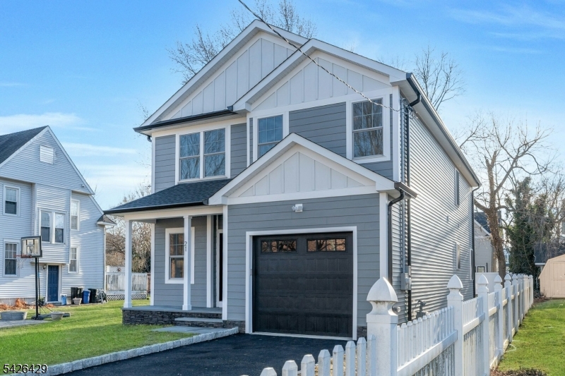 21 Spruce Street Cranford, NJ 07016 - Photo 2 of 40 a front view of a house with a yard