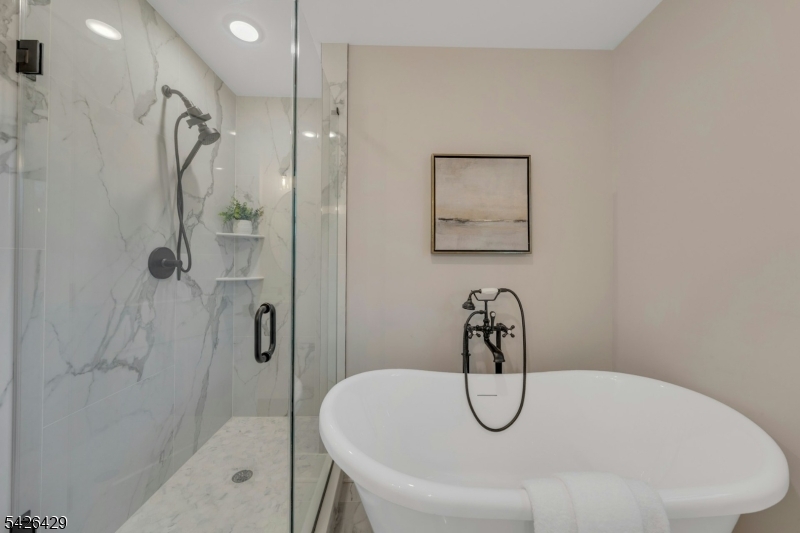21 Spruce Street Cranford, NJ 07016 - Photo 22 of 40 a bathroom with a bath tub and a shower