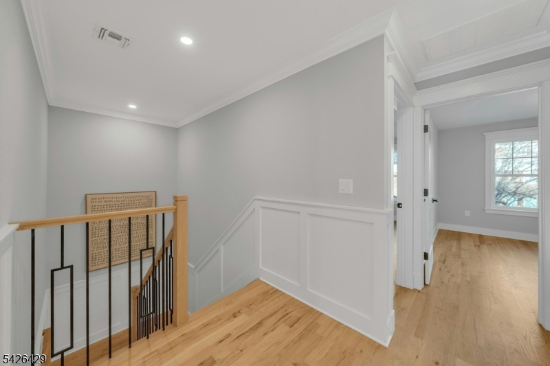 21 Spruce Street Cranford, NJ 07016 - Photo 23 of 40 a view of hallway with wooden floor