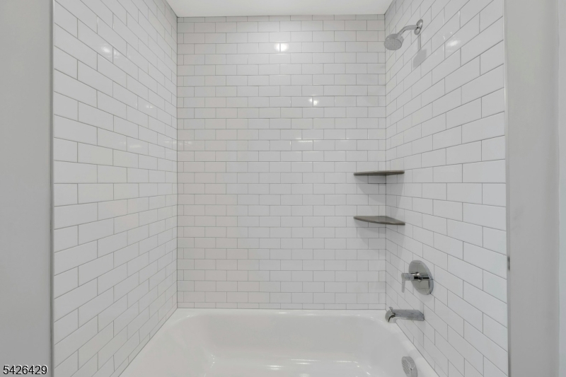 21 Spruce Street Cranford, NJ 07016 - Photo 29 of 40 a bathroom with a shower
