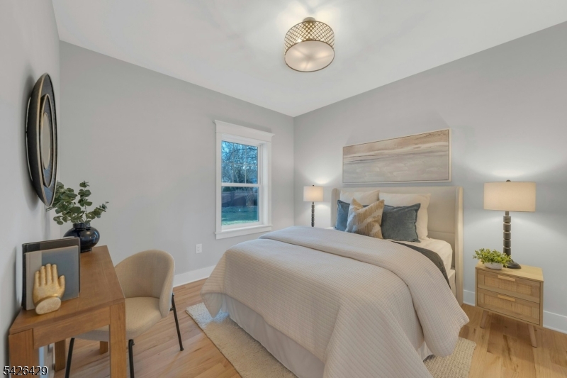 21 Spruce Street Cranford, NJ 07016 - Photo 30 of 40 a bedroom with furniture and a bed