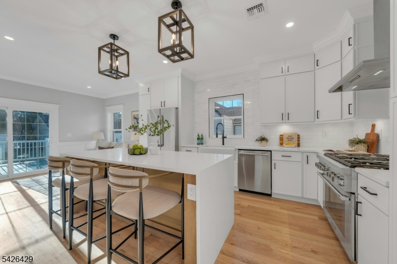 21 Spruce Street Cranford, NJ 07016 - Photo 3 of 40 a kitchen with a table and chairs in it