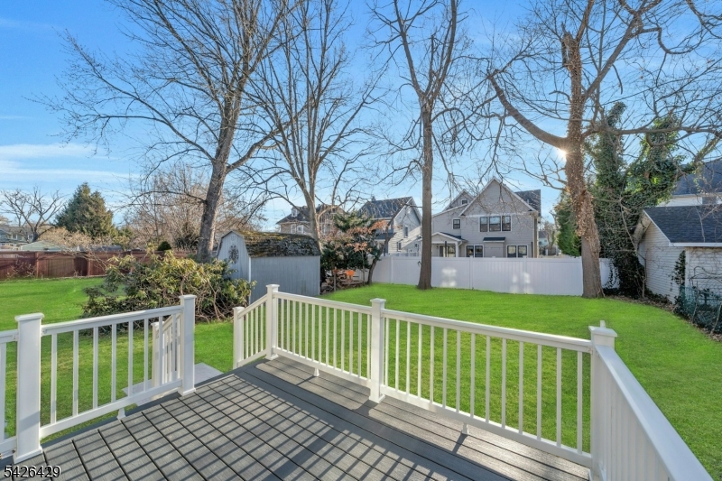 21 Spruce Street Cranford, NJ 07016 - Photo 35 of 40 a view of a house with a wooden fence