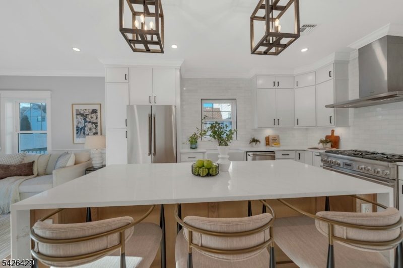 21 Spruce Street Cranford, NJ 07016 - Photo 5 of 40 a kitchen with a table and chairs in it