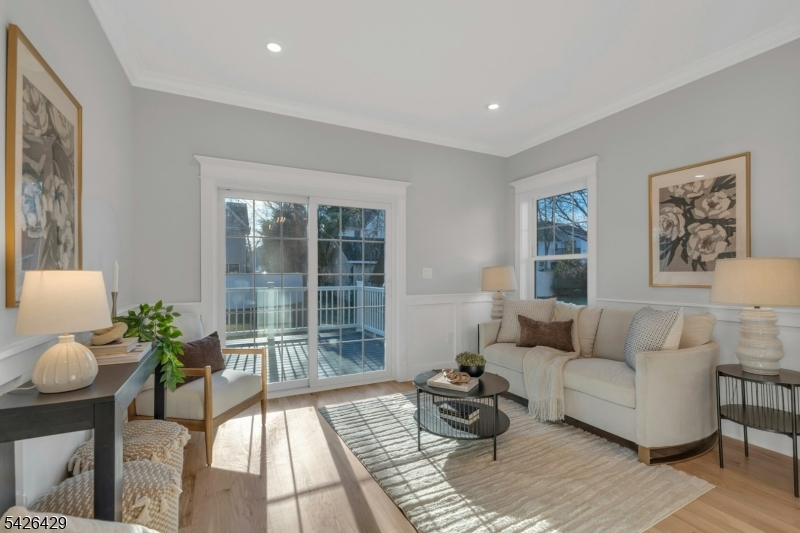 21 Spruce Street Cranford, NJ 07016 - Photo 9 of 40 a living room with furniture and a potted plant