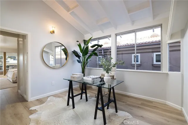 a view of a room with a table and chairs
