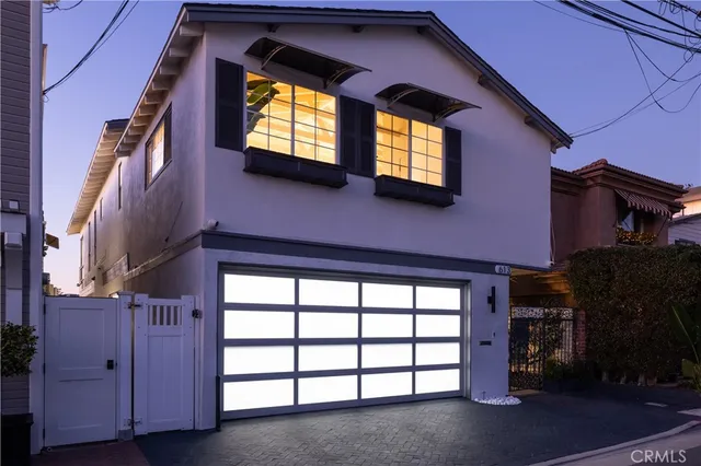 front view of a house with a large window