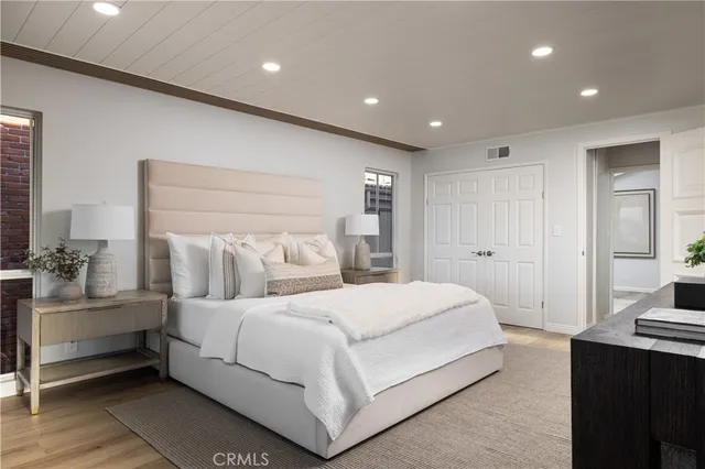 a bedroom with a bed and a walk in closet